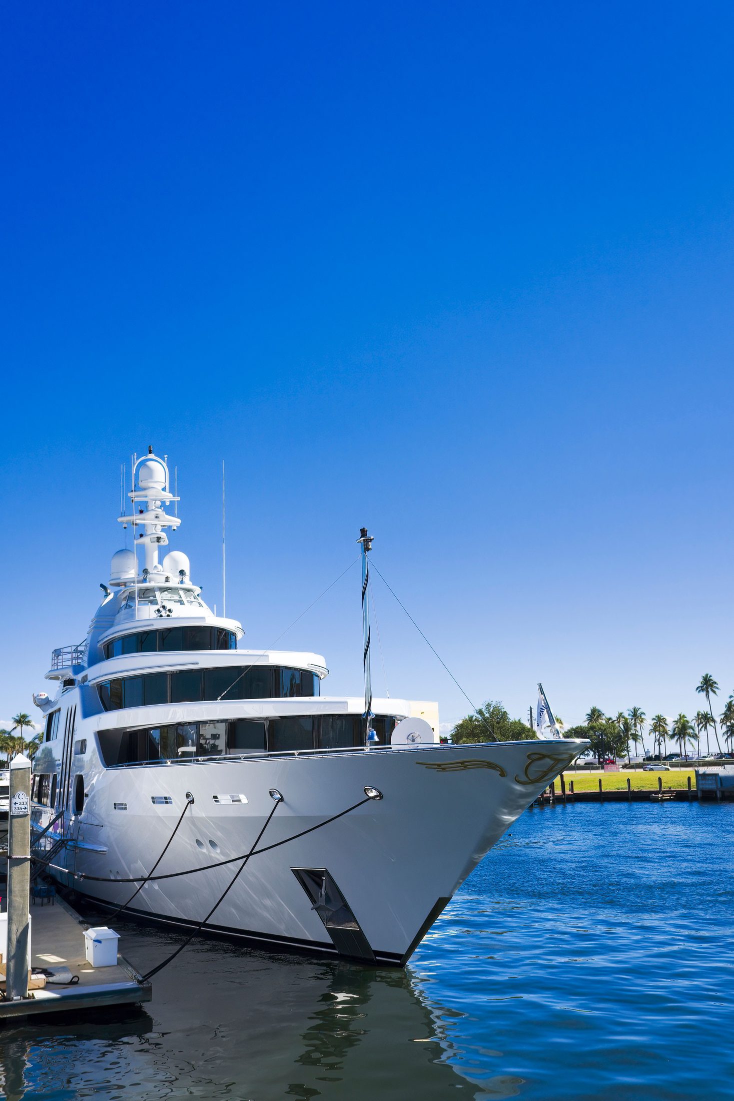 Yacht bow docked at a sunny Miami marina